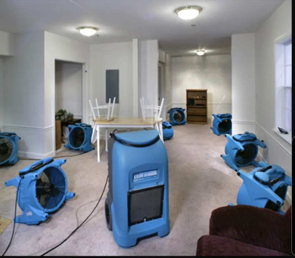 Air movers and dehumidifier setup for Water Damage Restoration in Wahoo